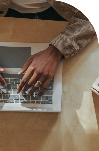 Woman typing on their laptop