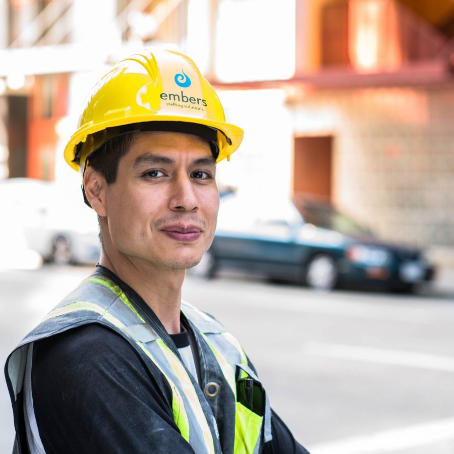 Embers worker wearing yellow construction hat